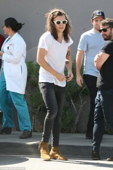 Cute: The One Direction heart-throb put his striking tattoos on show in a casual white top and jeans combination as he made his way out of The Lemonade eatery