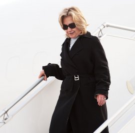 US Secretary of State Hillary Clinton steps off her US goverment airplane March 14, 2011, as she arrives at Le Bourget Airport, northern Paris, to attend meetings with Group of Eight world leaders on the unrest in Libya. The nations are to discuss proposals to impose a no-fly zone over Libya which would aim to ground aircraft of forces loyal to its ruler Moamer Kadhafi which are waging a fierce assault against rebels. AFP PHOTO / POOL PAUL J. RICHARDS (Photo credit should read PAUL J. RICHARDS/AFP/Getty Images)